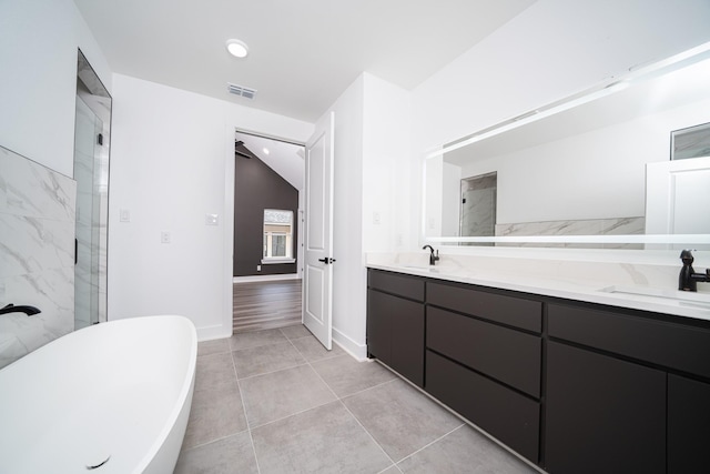 bathroom featuring vanity and plus walk in shower