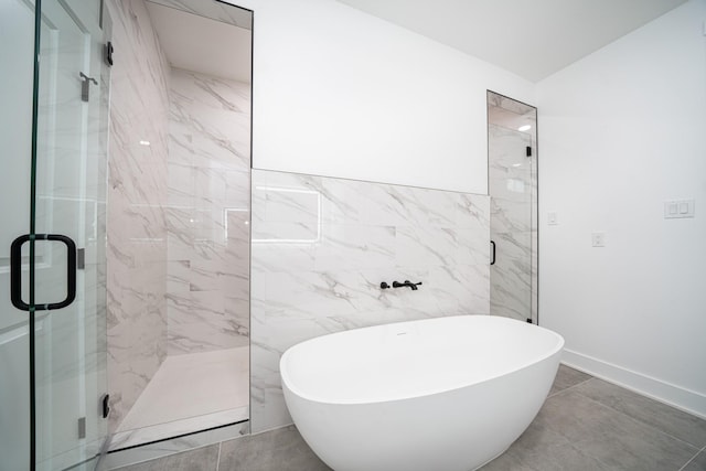 bathroom featuring independent shower and bath and tile walls