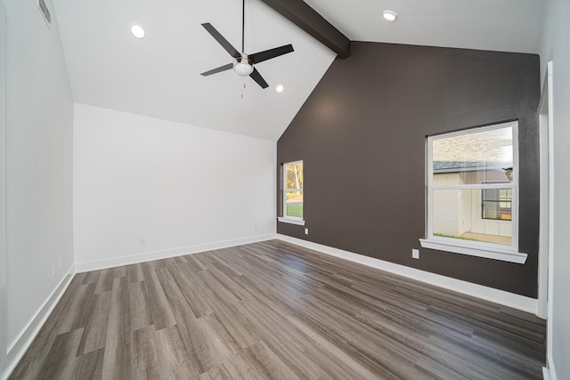 spare room with beamed ceiling, ceiling fan, hardwood / wood-style floors, and high vaulted ceiling