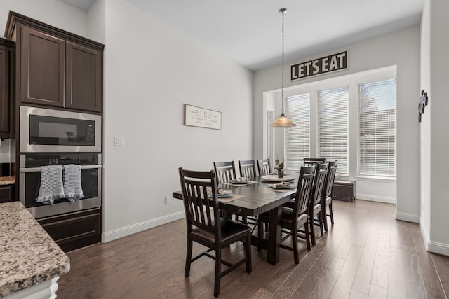 dining space featuring dark hardwood / wood-style floors