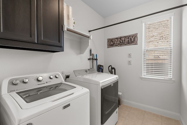 laundry area with cabinets and washer and dryer