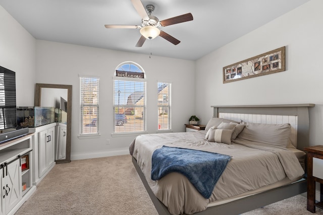 bedroom with light colored carpet and ceiling fan