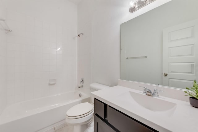 full bathroom featuring tiled shower / bath, vanity, toilet, and tile patterned flooring