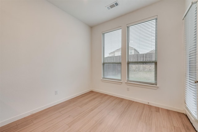 unfurnished room with light hardwood / wood-style flooring