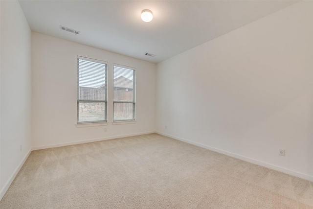 empty room with light colored carpet