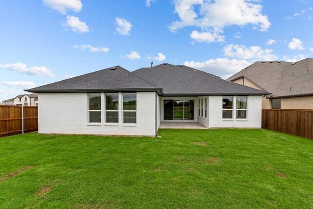 11529 Wulstone Rd, Fort Worth, TX 76052 - back of house featuring brick siding, a shingled roof, and a patio