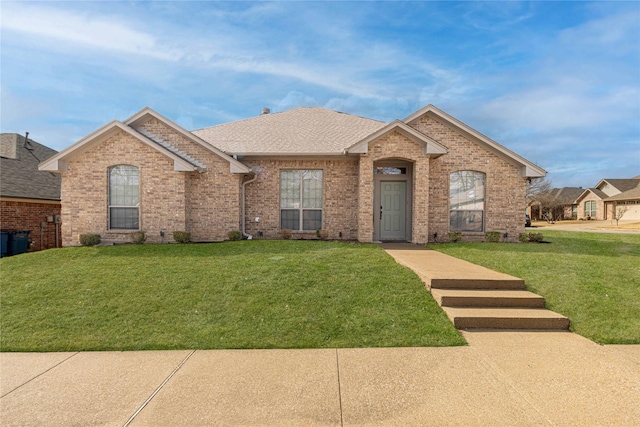 19482 Ruggles Ct, Flint, TX 75762 - view of front of home featuring brick siding, a front lawn, and roof with shingles