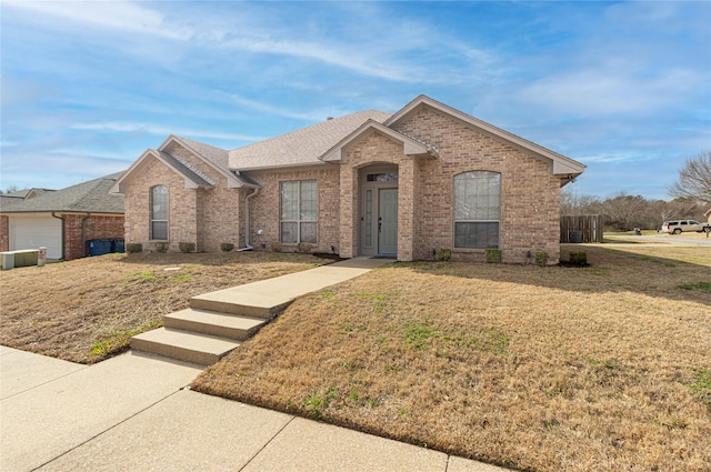 ranch-style home with a front lawn