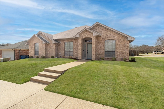 19482 Ruggles Ct, Flint, TX 75762 - view of front of property with brick siding, a front yard, and roof with shingles