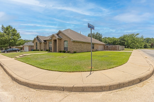 view of front of home with a garage and a front yard