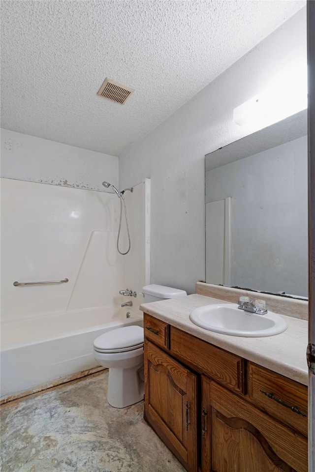 full bathroom with shower / bathtub combination, vanity, toilet, and a textured ceiling