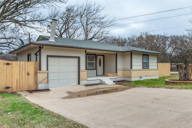 single story home featuring a garage