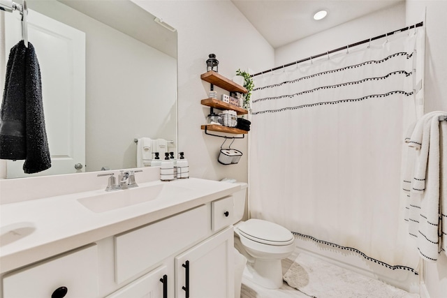 full bathroom featuring toilet, shower / tub combo, and vanity