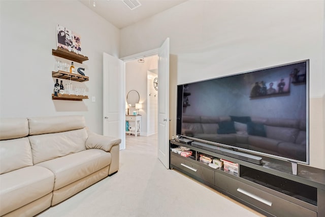 carpeted living room featuring visible vents