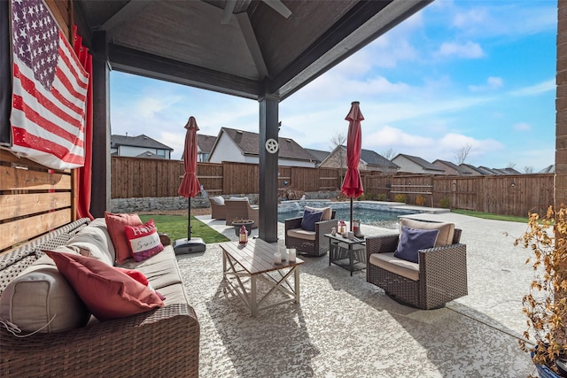 view of patio with a fenced backyard, outdoor lounge area, and a fenced in pool