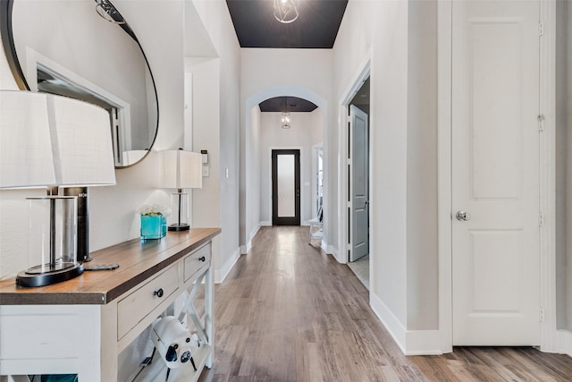 1845 Leo Dr, Van Alstyne, TX 75495 - entryway featuring arched walkways, light wood-style floors, and baseboards