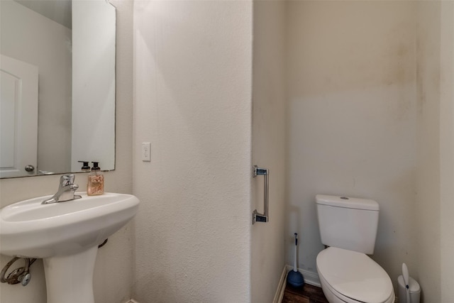 bathroom featuring toilet