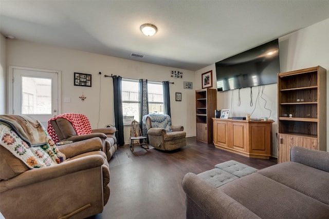 living room featuring dark hardwood / wood-style flooring