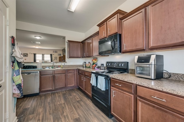 kitchen featuring dark hardwood / wood-style floors, sink, and black appliances