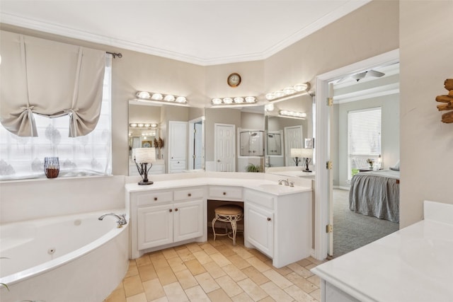 ensuite bathroom featuring a tub with jets, ornamental molding, ensuite bathroom, and vanity