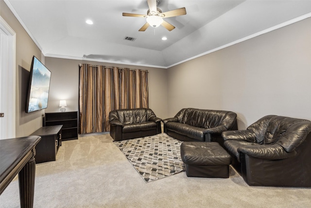 living area with crown molding, recessed lighting, a raised ceiling, a ceiling fan, and light carpet