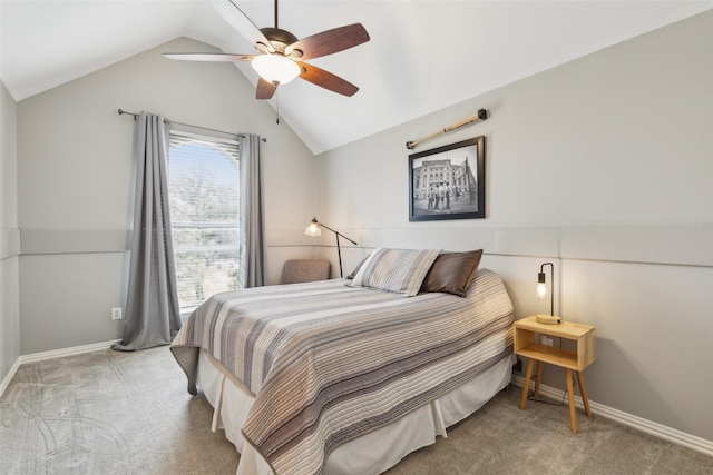 bedroom featuring light carpet, vaulted ceiling, a ceiling fan, and baseboards