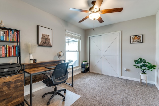 carpeted home office with ceiling fan