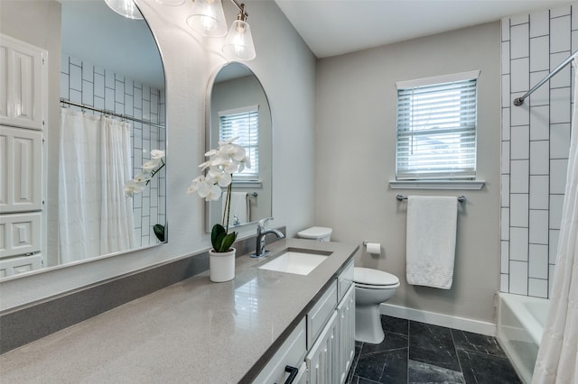 full bathroom featuring vanity, shower / bath combo with shower curtain, and toilet