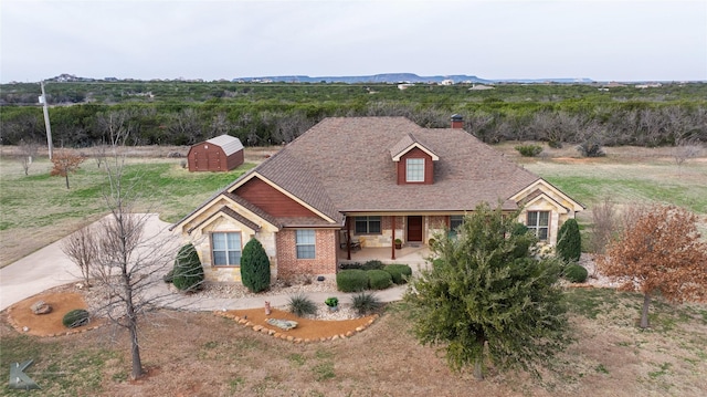 view of front of property with a storage unit