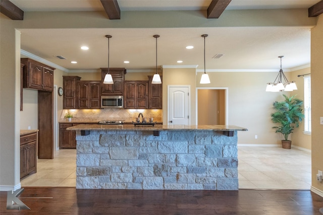 158 Stardust Trl, Tuscola, TX 79562 - kitchen with stainless steel microwave, backsplash, dark stone counters, recessed lighting, and beam ceiling