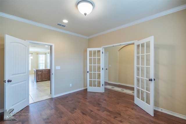 spare room with french doors, dark hardwood / wood-style floors, and crown molding