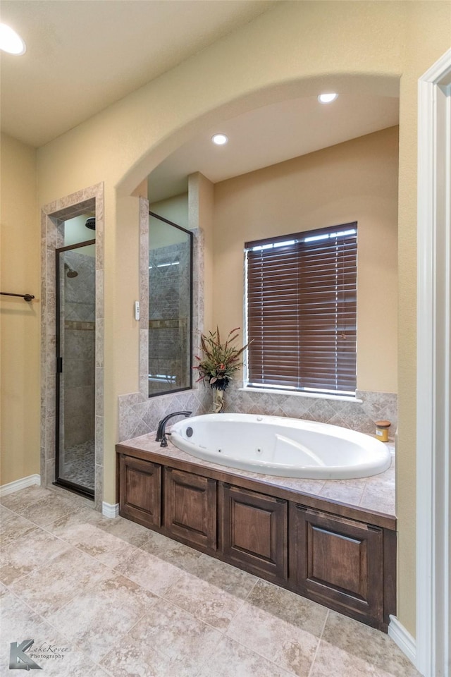 158 Stardust Trl, Tuscola, TX 79562 - full bath featuring a jetted tub, a stall shower, and recessed lighting