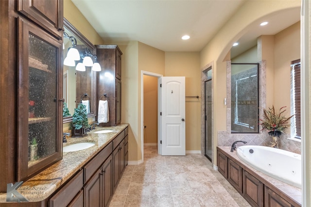 bathroom featuring vanity and plus walk in shower