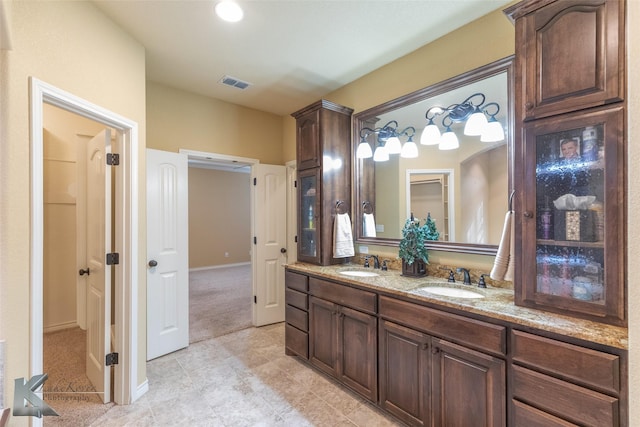158 Stardust Trl, Tuscola, TX 79562 - full bath featuring double vanity, tile patterned flooring, and baseboards
