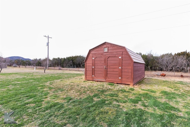 view of outbuilding featuring a yard