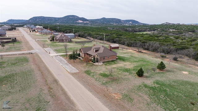 drone / aerial view featuring a mountain view