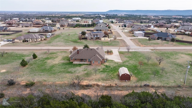 158 Stardust Trl, Tuscola, TX 79562 - aerial view of property and surrounding area with nearby suburban area and a mountainous background