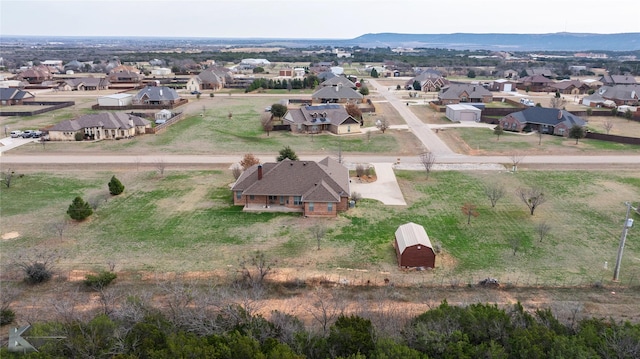 drone / aerial view featuring a mountain view