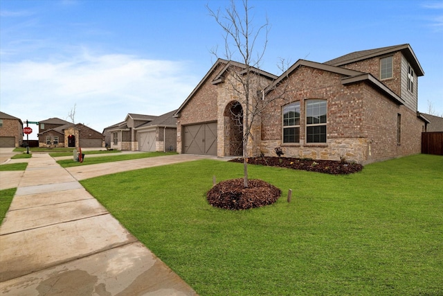 view of front of house with a garage and a front lawn