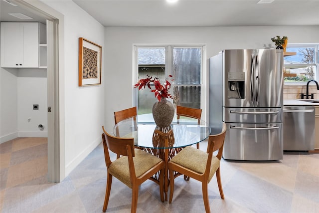 dining room with a healthy amount of sunlight and sink