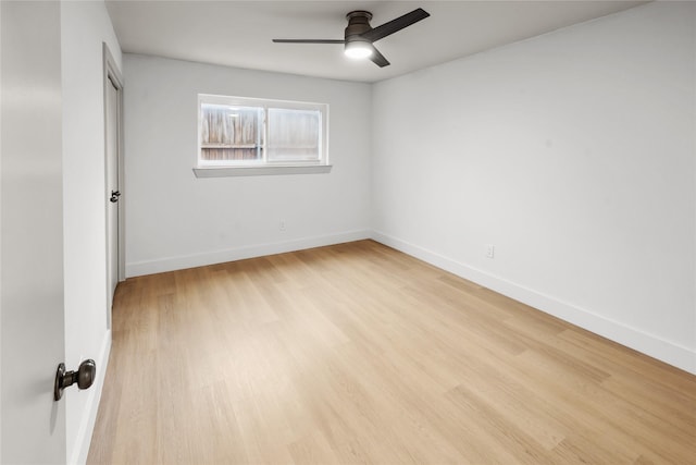 spare room with light hardwood / wood-style flooring and ceiling fan