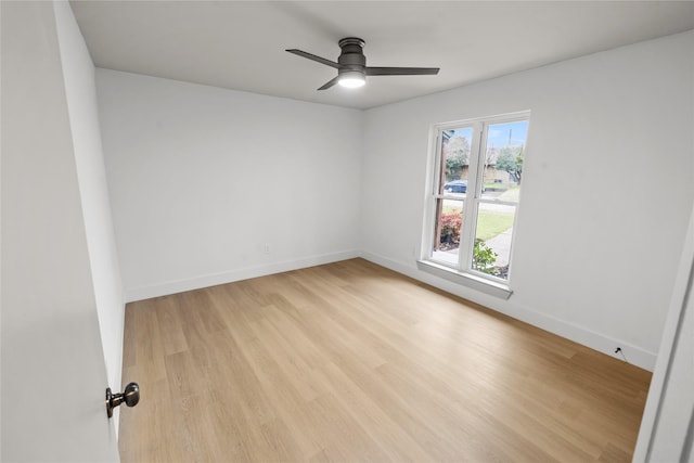 spare room featuring ceiling fan and light hardwood / wood-style floors