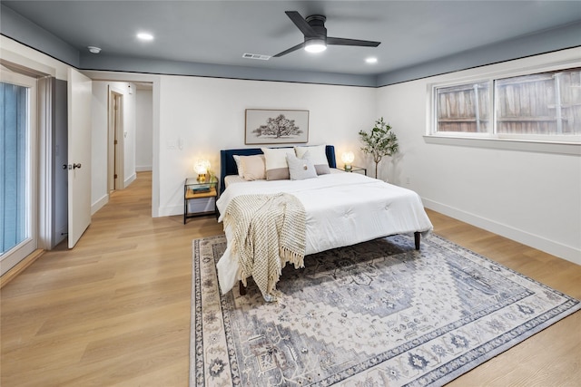 bedroom with ceiling fan and light wood-type flooring