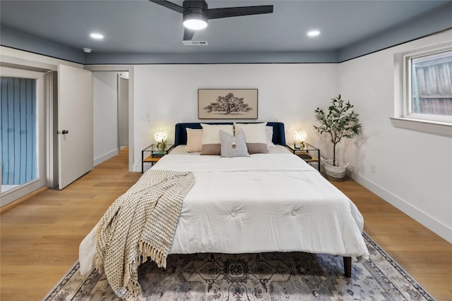 bedroom with ceiling fan and light wood-type flooring