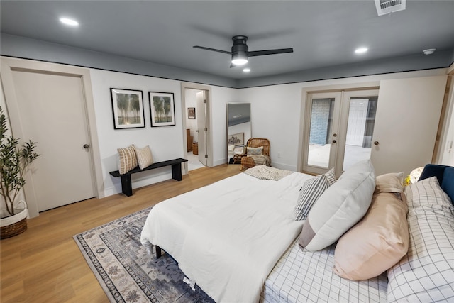 bedroom with access to exterior, french doors, ceiling fan, and light wood-type flooring