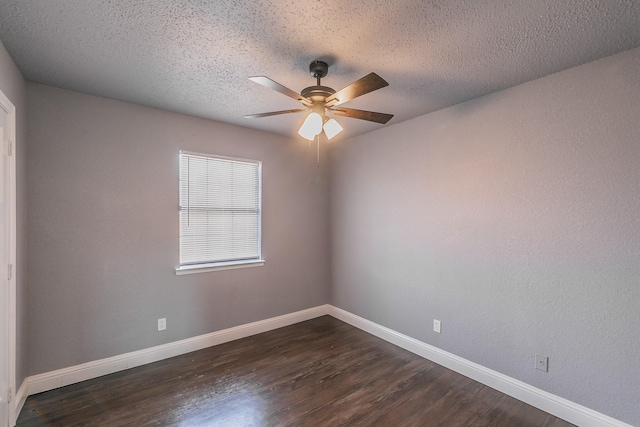 spare room featuring dark hardwood / wood-style floors, a textured ceiling, and ceiling fan