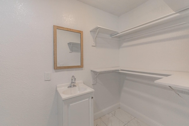 walk in closet with sink