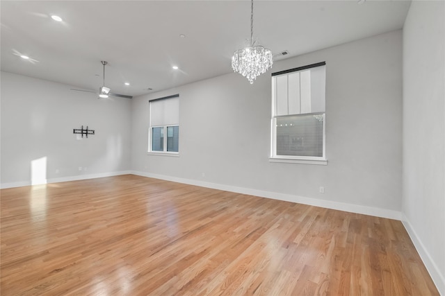 625 N Tyler St Unit 402, Dallas, TX 75208 - empty room featuring baseboards, ceiling fan with notable chandelier, recessed lighting, and light wood-style flooring