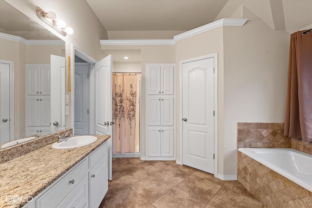 bathroom featuring vanity, tile patterned flooring, crown molding, and tiled bath