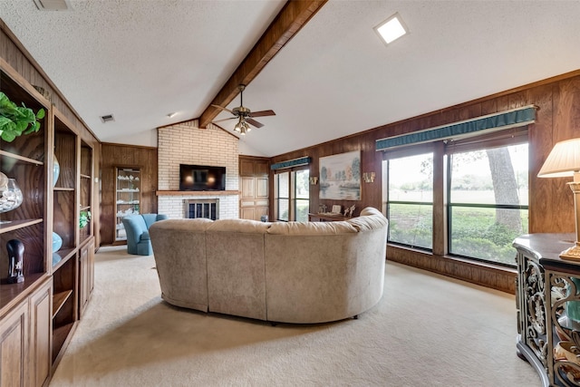 living room featuring a brick fireplace, light carpet, and wood walls